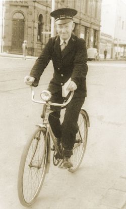Senior Postman Jim Pilmer on his bicycle in Kew, circa 1950. Photograph courtesy Joanna Campbell.