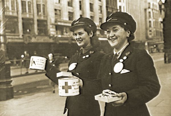 M&MTB conductresses selling Red Cross buttons, 23 June 1944. Photograph Australian War Memorial