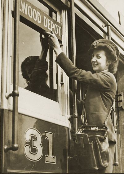 VR conductress changing side destination board. Photograph State Library Victoria