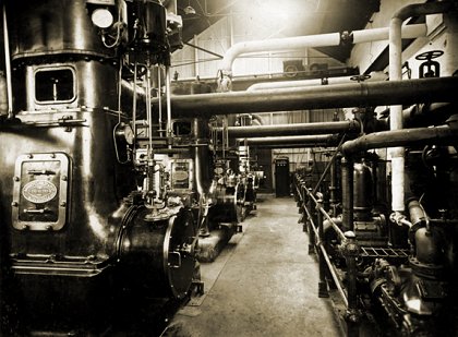  Interior of NMETL power house circa 1920, showing reciprocating steam engines and steam pipework from adjoining boiler room. Photograph TMSV